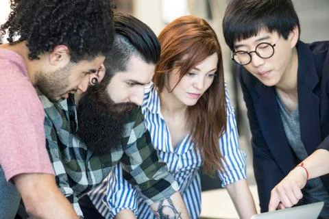 Colleagues working together on project Stock Photos
