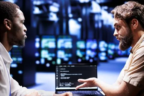 Colleagues write server script code Stock Photos