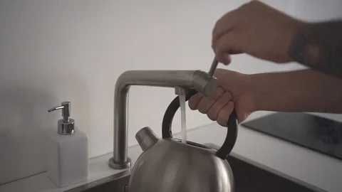 Collect water in the kettle Stock Footage 110905657