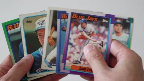 Collecting and looking at old baseball cards from the 1990s Stock Footage 256081697