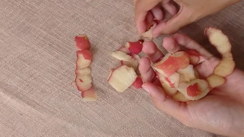 Collecting the apple skin on the table Stock Footage 150399478