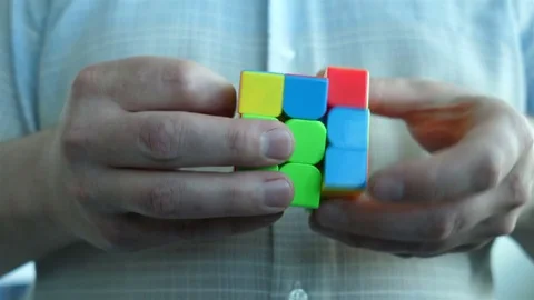 Collecting a bright rubik's cube at the time Stock Footage 77448990