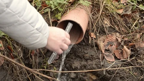 Collecting drain pipe water sample with test tube Stock Footage 102060624