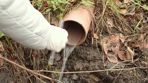 Collecting drain pipe water sample with test tube 動画素材 102060673