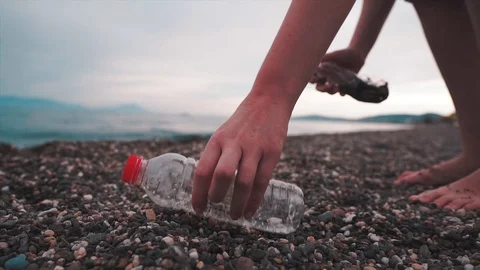 Collecting garbage, plastic bottle on beach. Volunteer is working Video stock 112266924