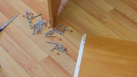 Collecting parts of computer table screwing sliding mechanism screwdriver. Stock-Footage 124894523