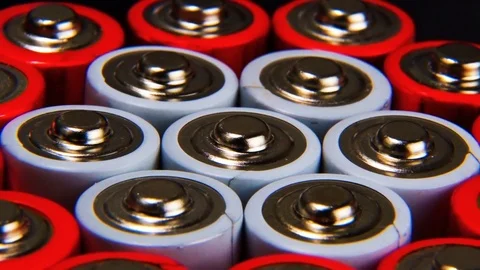 A collection of AA batteries, an extremely close-up, rotate. Batteries are re Stock Footage 85455995
