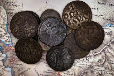 Collection of Antique 1 Doit Java Coins on Vintage Map 스톡 사진