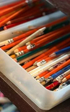 A collection of assorted colored pencils and drawing tools neatly arranged .. Stock Photos
