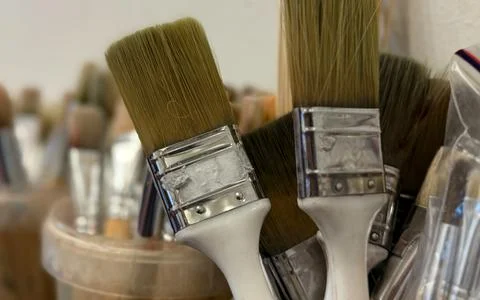 Collection of assorted paint brushes with metal ferrules in various contain.. Stock Photos