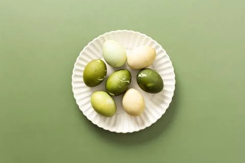 A collection of beautifully dyed Easter eggs in various shades of green and p Stock Photos