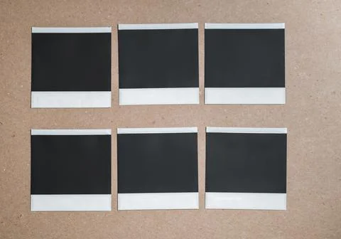 Collection of blank photo frames isolated on brown background. Set of photos Stock Photos
