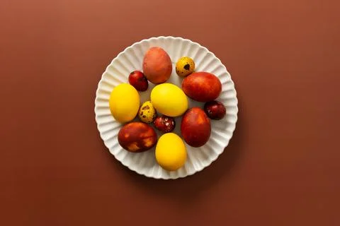A collection of brightly colored Easter eggs in various sizes and patterns .. Stock Photos