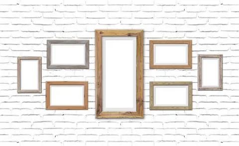 Collection of brown wood frames on brick wall. For interiors decor mockup イラスト素材