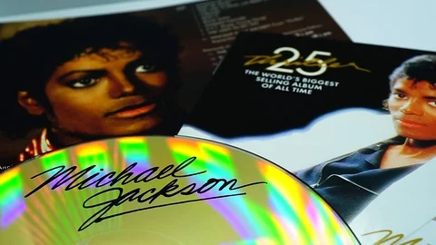 Collection of CD covers and insert by MICHAEL JACKSON. an American singer Stock Footage 102971541