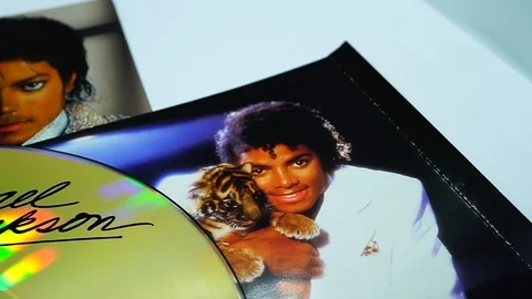 Collection of CD covers and insert by MICHAEL JACKSON. an American singer Stock Footage 102971553
