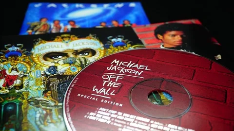 Collection of CD covers of three solo albums by MICHAEL JACKSON in detail Stock Footage 104108692
