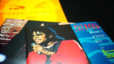 Collection of CD covers of three solo albums by MICHAEL JACKSON in detail Stock Footage 104108698