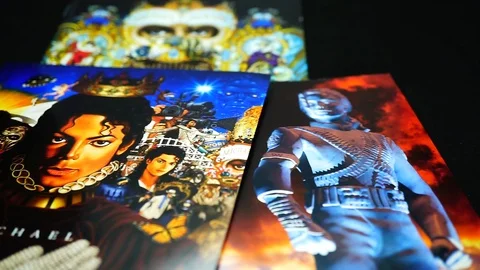 Collection of CD covers of three solo albums by MICHAEL JACKSON in detail Stock Footage 104108701