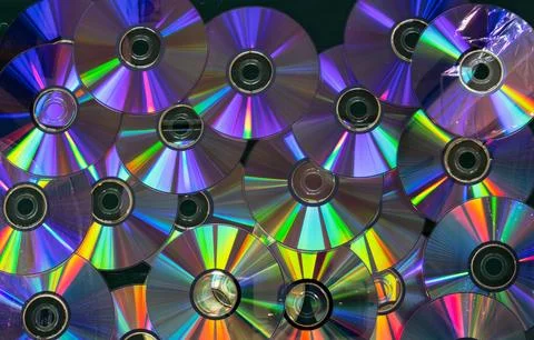 A collection of CDs with a rainbow effect Stock Photos