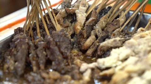 A collection of chicken satay and beef satay Stock Footage 265789166