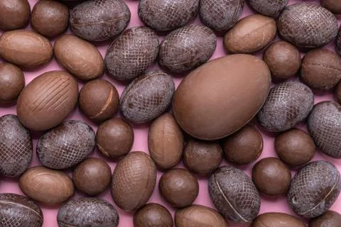 Collection of chocolate Easter eggs over pink, holiday background 스톡 사진