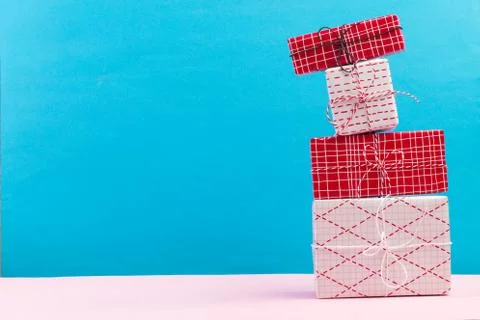 Collection of Christmas present boxes on a light blue background Stock Photos