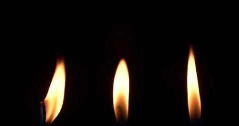 Collection of close-up burning candle fire flame isolated on black background Stock Footage 258318129