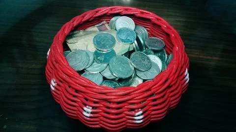 Collection of coins in a red case. Stock Photos