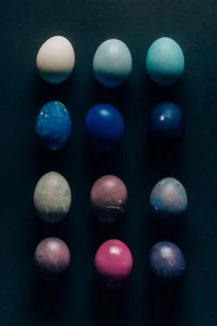 Collection of colored painted easter eggs on dark tabletop 스톡 사진