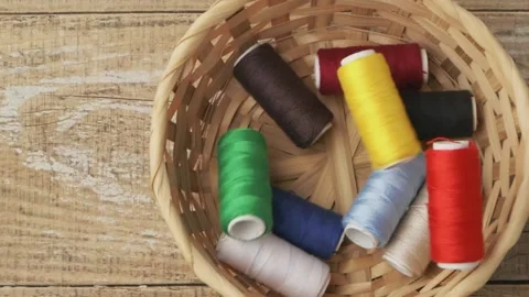 A collection of Colorful Spools of Thread beautifully arranged in a charming Видео 289291055