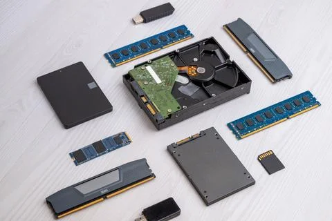Collection of computer storage devices including hard drive, SSD, RAM modul.. Stock Photos