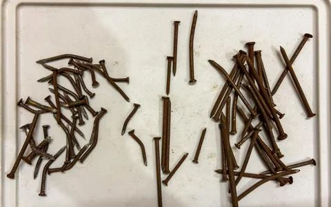 Collection Of Corroded Nails Representing Construction Repair And Maintenance Stock Photos