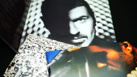 Collection of covers and cd inserts of the  the English artist GEORGE MICHAEL Stock Footage 105615757