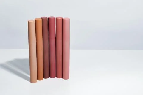 A collection of cylindrical rubber or plastic tubes in various earthy tones.. Stock Photos