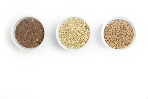 Collection of different groats on white background. Top view of buckwheat, chia Stock Photos