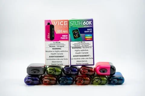 Collection of disposable electronic cigarette packages and vape devices. Toronto Stock Photos