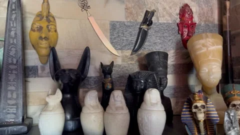 Collection of Diverse Cultural Artifacts and Antique Souvenirs on Display Shelf Stock Footage 344789875