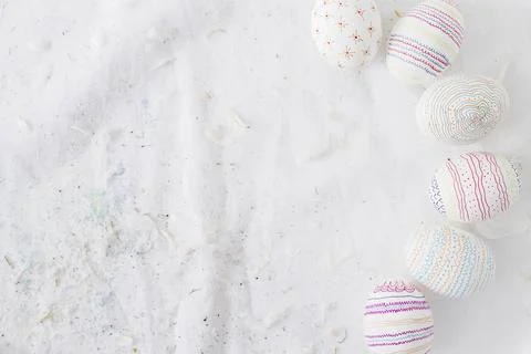Collection easter eggs with patterns near quills textile Stock Photos