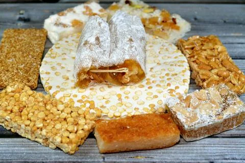 Collection of Eastern candy chickpeas, peanuts, sesame, walnuts taffy, coconu Stock Photos