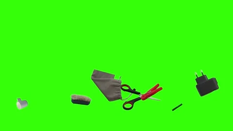 Collection of everyday objects falling against a green screen background Stock Footage 340387103