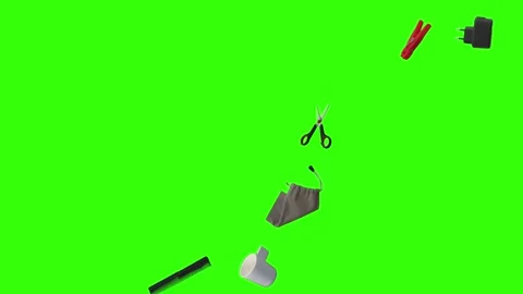 Collection of everyday objects falling against a green screen background Stock Footage 340387111