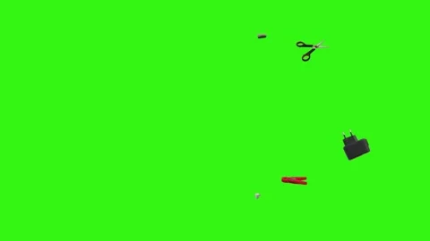 Collection of everyday objects falling against a green screen background Stock Footage 340387118