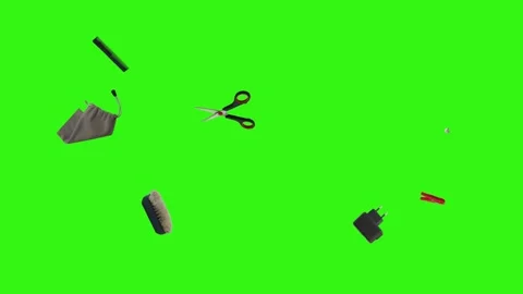 Collection of everyday objects falling against a green screen background Stock Footage 340387120