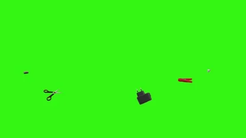 Collection of everyday objects falling against a green screen background Stock Footage 340387121