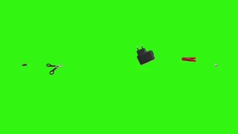 Collection of everyday objects falling against a green screen background Stock Footage 340387122