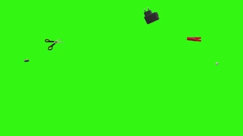 Collection of everyday objects falling against a green screen background Stock Footage 340387131