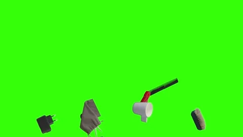 Collection of everyday objects falling against a green screen background Stock Footage 340387143