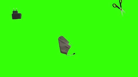 Collection of everyday objects falling against a green screen background Stock Footage 340387148
