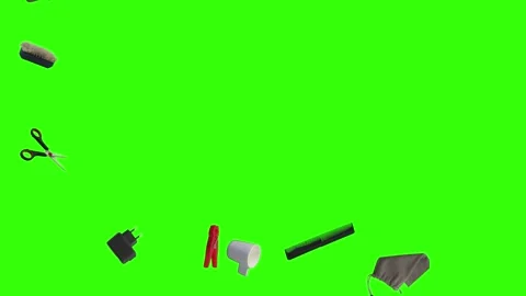 Collection of everyday objects falling against a green screen background Stock Footage 340387155